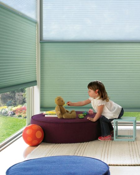 Light green custom window blinds, perfect for child-safe window treatments and energy-efficient home decor.