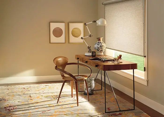 Contemporary window blind in a stylish home office setting providing light control and privacy. Perfect for modern interiors, featuring a sleek design and neutral tones.