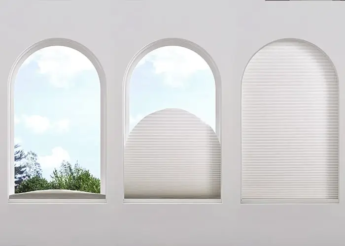 Roll-up window blinds on white arched windows for privacy and light control, featuring custom window coverings from Advance Blinds & Drapery.
