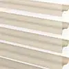Soft beige fabric blinds with horizontal slats, stylish and functional window treatment for modern homes.