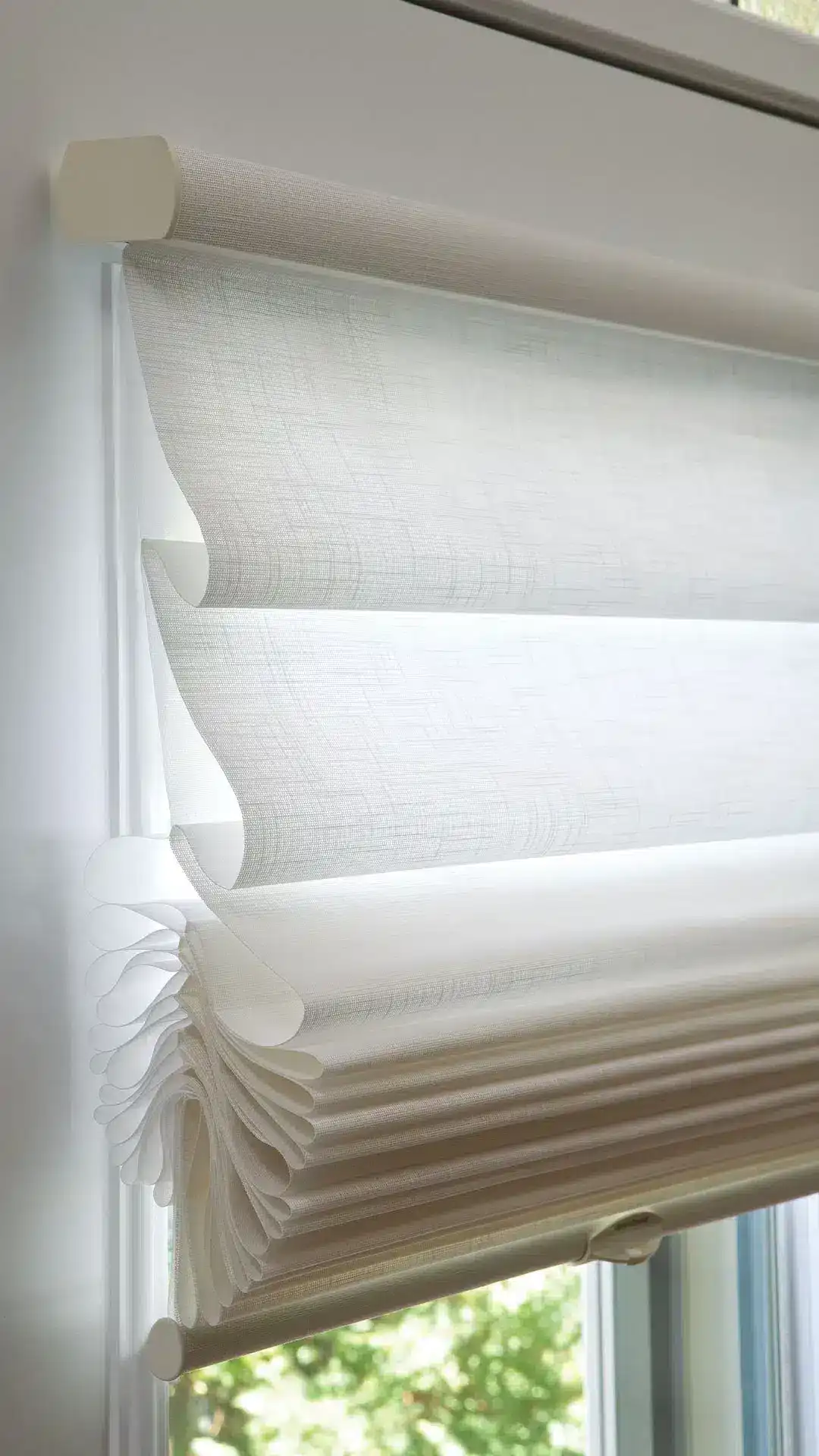 Light-filtering white roller shades for privacy and sunlight control.
