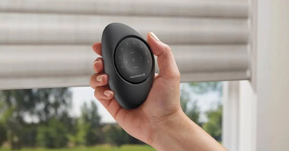 Remote control for automated window blinds and drapery systems by Advance Blinds & Drapery, offering convenient smart home window treatment solutions.