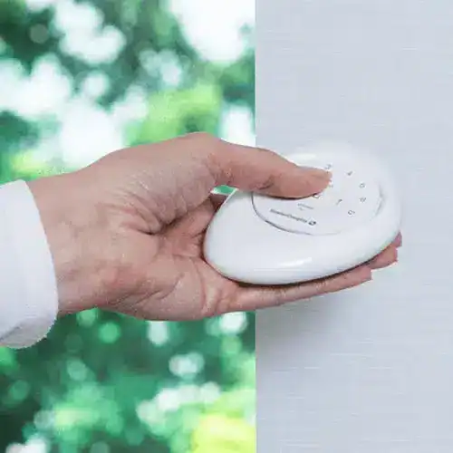 Wireless window blind remote control for easy shade adjustment at Advance Blinds & Drapery.