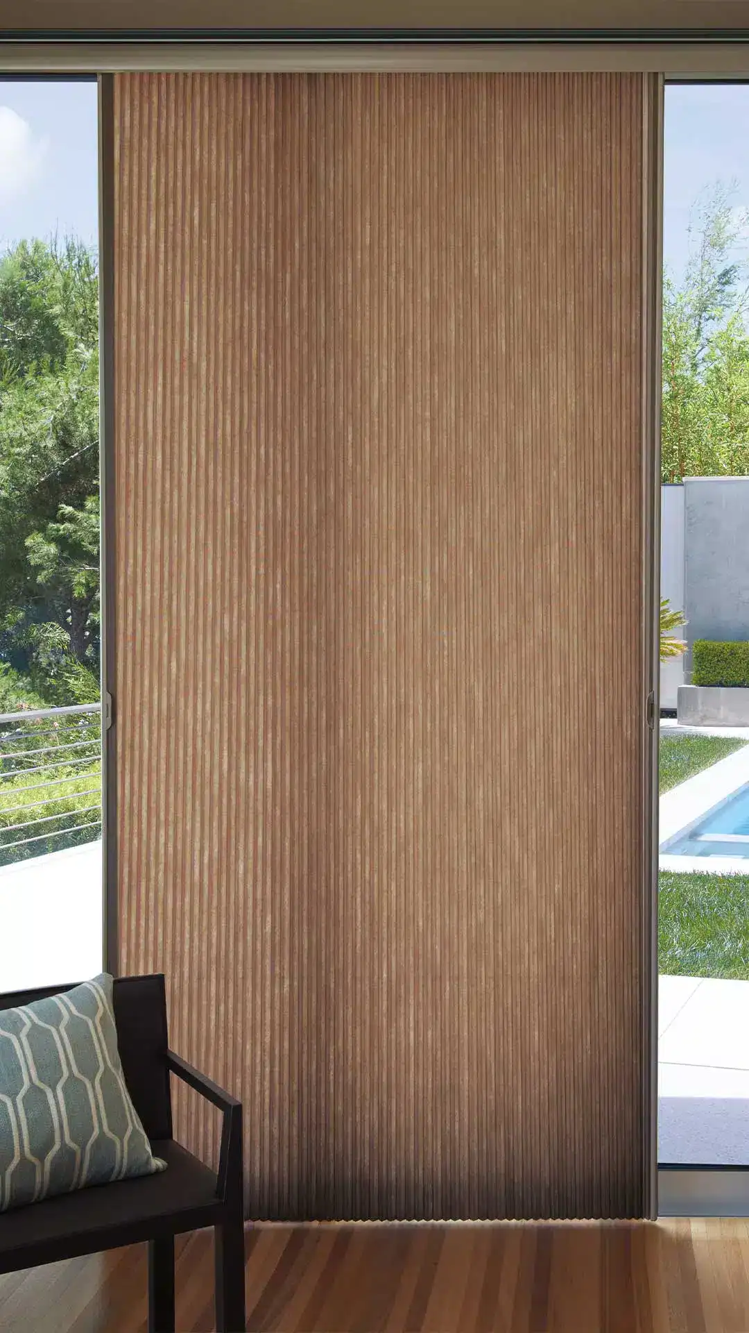Powder-coated sliding door with vertical wooden slat blinds, ideal for modern home interior window treatment.