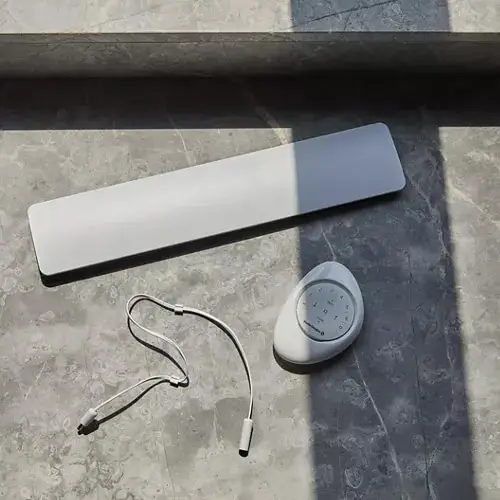 Wireless remote control device and accessory for smart window blinds and drapery systems in modern home interior.