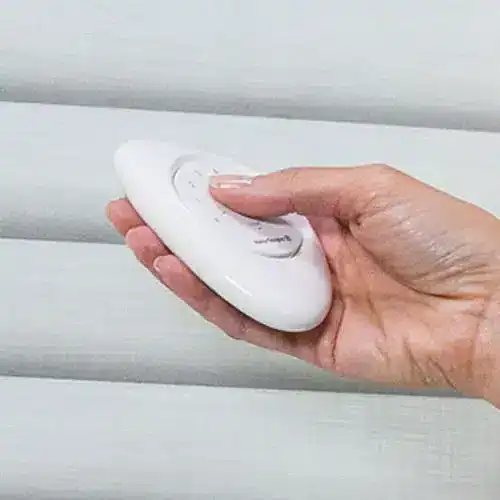 Automatic window blind remote control device in use for smart home window shade operation.