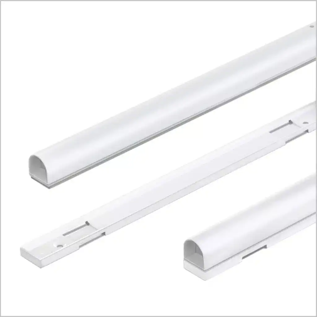 Adjustable white drapery track system for curtains and blinds, enhancing window treatments with smooth operation and modern design.