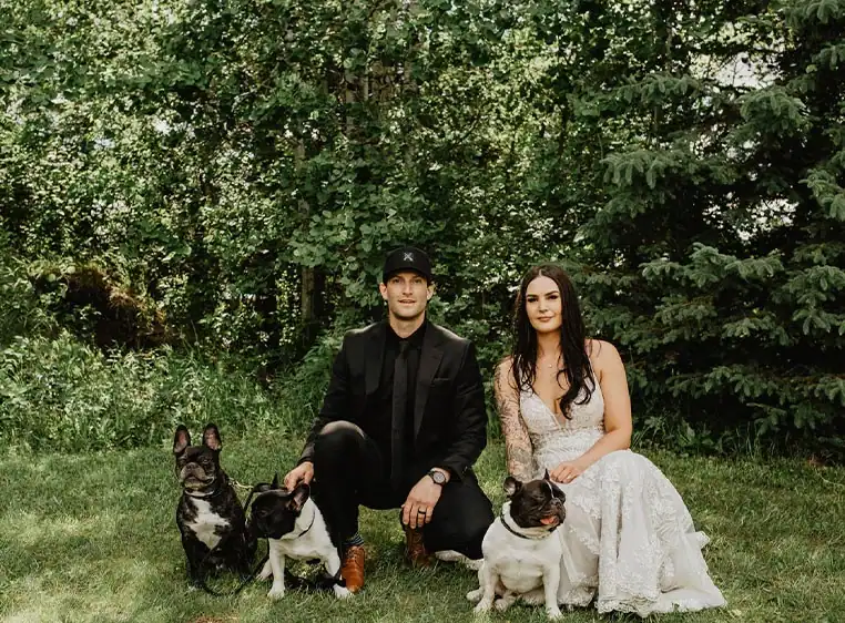 Modern black and white window blinds with lush green background for home decor and privacy enhancement.