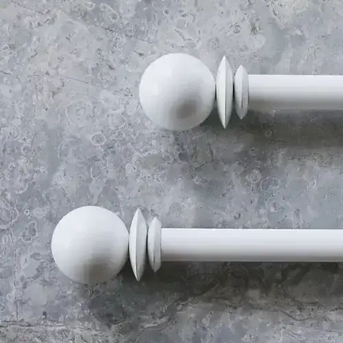 Elegant white curtain rod with spherical finials ideal for home window treatments and drapery systems. Perfect for enhancing your interior decor with custom blinds and window treatments.