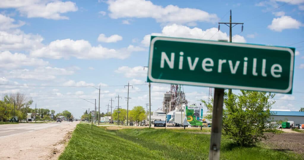 Nervville road sign in a small town, promoting quality window treatments and custom blinds services from Advance Blinds & Drapery.